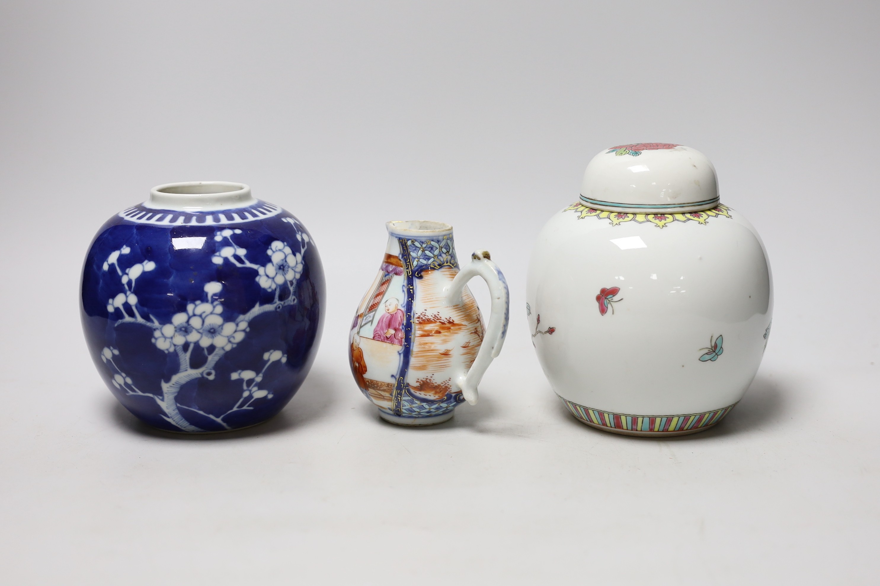 A Chinese famille rose Mandarin sparrow beak jug, Qianlong period, 10.5cm high and two 20th Centry porcelain jars
